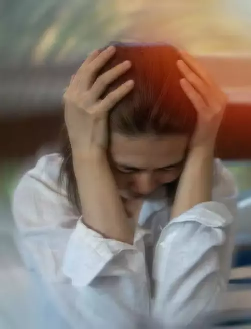 Woman experiencing dizziness and vertigo